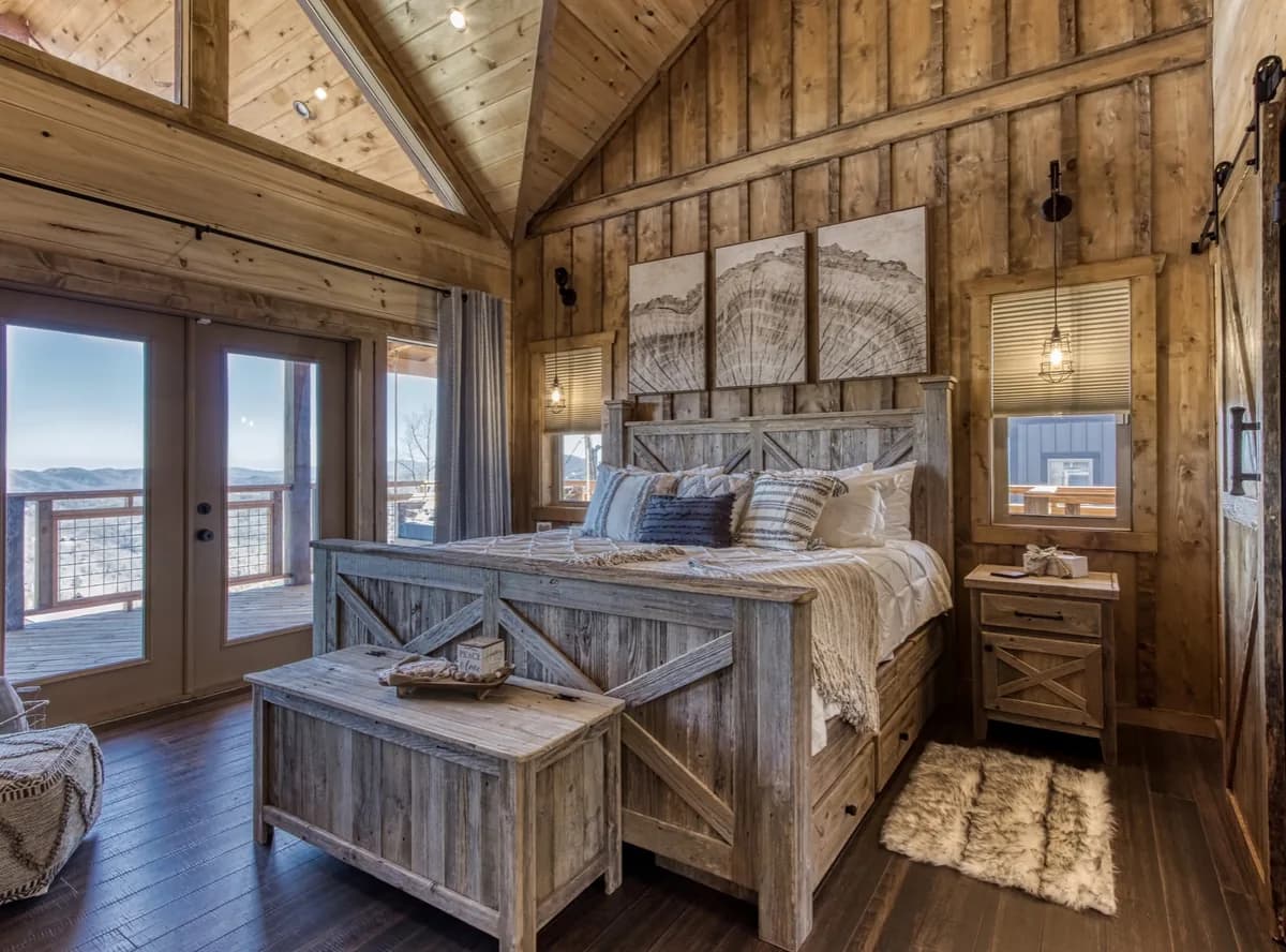 A rustic vaulted cabin bedroom styled and reset between guests
